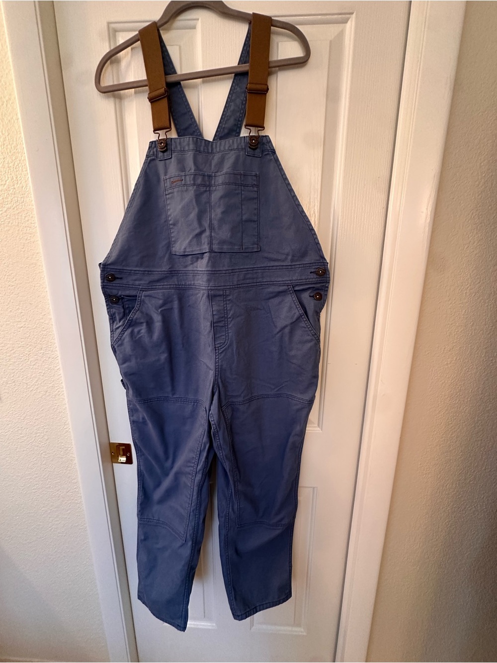 REI Cooperative blue canvas bib with tan stitch detail